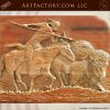 wood carving of Native American hunting on horseback