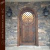 arched wood door portal window