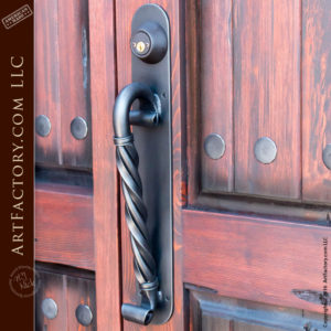 vertical groove panel front door with center twist scroll bar door pull