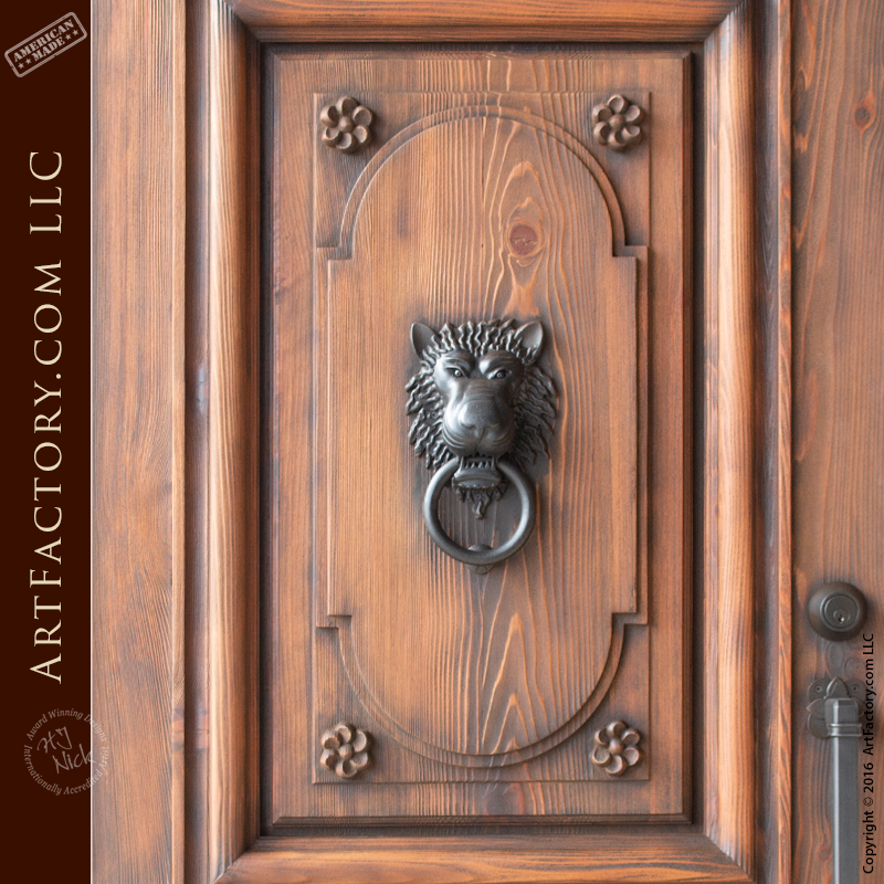 castle style double doors with lion head iron door knocker