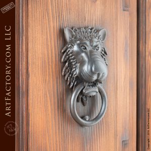 castle style double doors with lion head iron door knocker