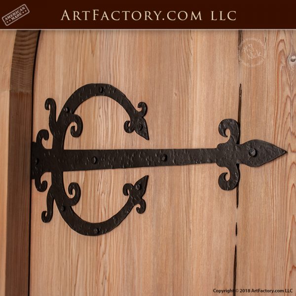 custom arched wood door with custom medieval strap hinges
