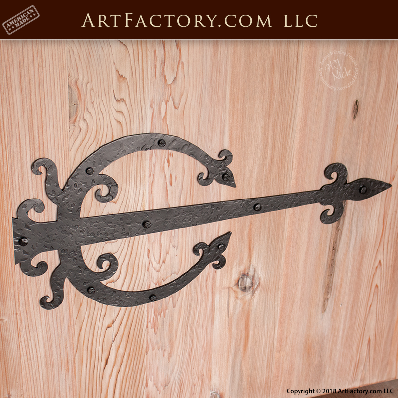 custom arched wood door with custom medieval strap hinges