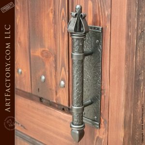 wooden castle gate with medieval dungeon door handle