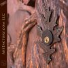 forest inspired hand carved entrance with custom oak leaf lock plate