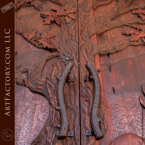 custom oak branch door handles on forest inspired hand carved entrance