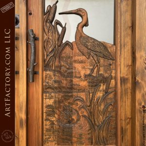 crane carving on door up close