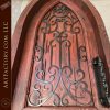 Solid Wood Cathedral Arch Door with Hand-Forged Iron Grill