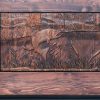 river scene carving on wood door panel