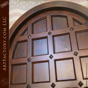 top of arched wooden fortress door up close