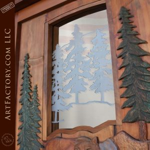 pine tree carvings and pine tree etched door glass up close