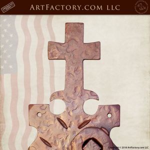 hand hammered iron cross on door handle