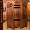 hand carved walnut armoire