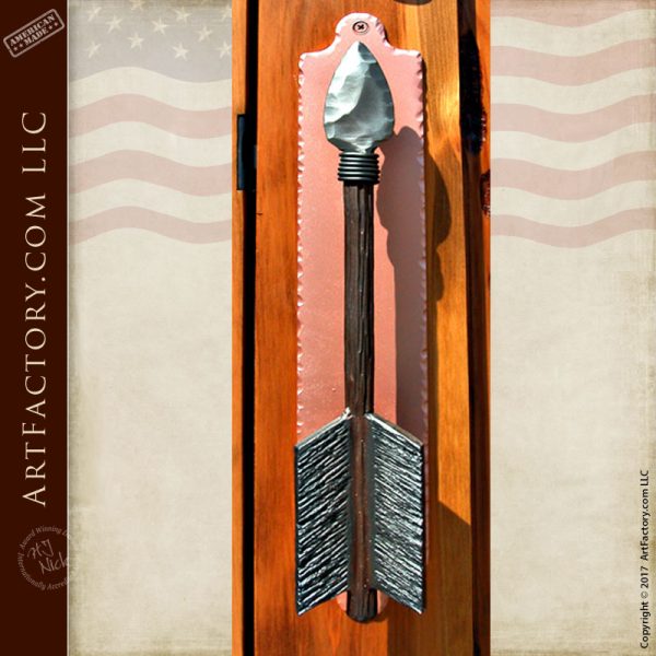 custom arrow door pull on Chief Joseph inspired hand carved door